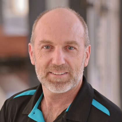 Dr Andrew Kirke smiles at the camera